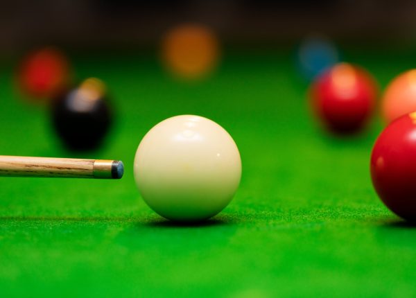 snooker game - player aiming the cue ball